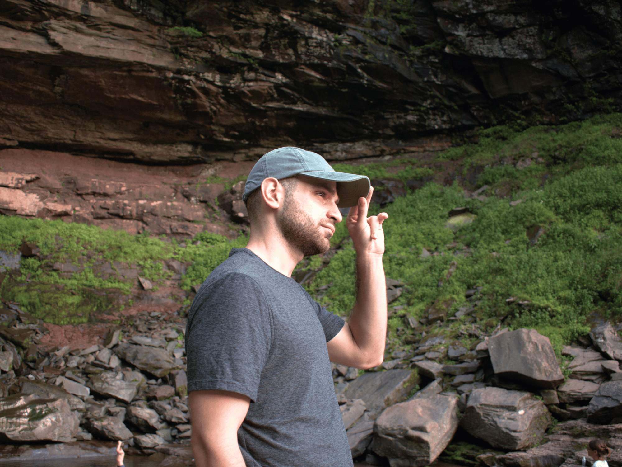 Man hiking with baseball hat