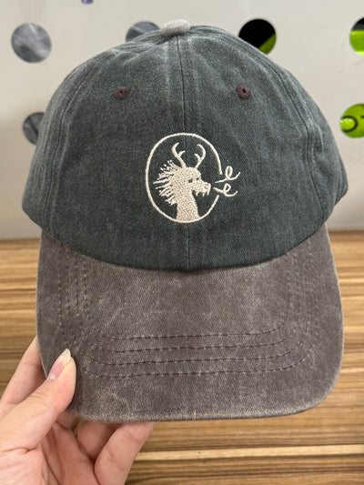 Cream dragon embroidery on a charcoal-green and brown Classic Cap