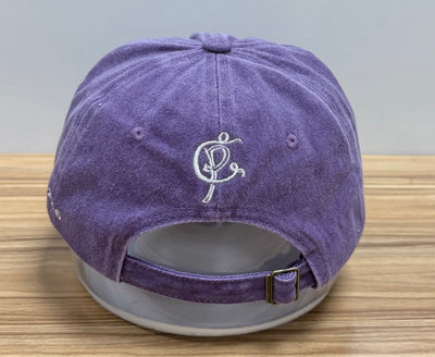 White monogram embroidered above the back opening of a lilac Classic Cap