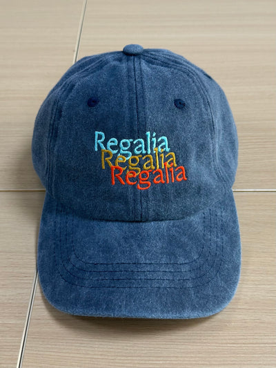 Multicolor Regalia lettering on a washed navy Classic Cap