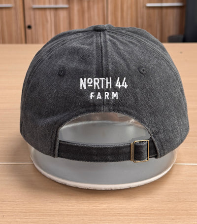 White North 44 Farm lettering on the back of a charcoal Classic Cap