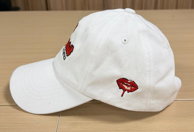 Red fish embroidery on the side of a white Classic Cap
