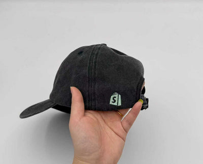 Shopify bag emblem embroidered on the side of a black Classic Cap